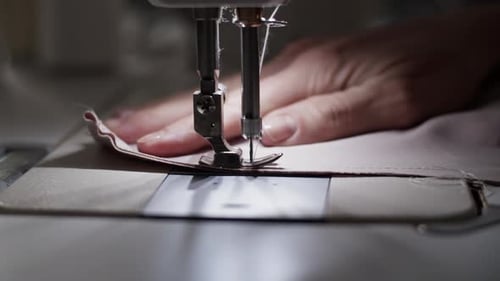 Anonymous Woman Stitching Cloth on Sewing Machine