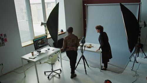 Photographer and Food Stylist Cooperating in Studio