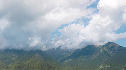 Green Mountains in Summer with Fluffy Clouds in Timelapse