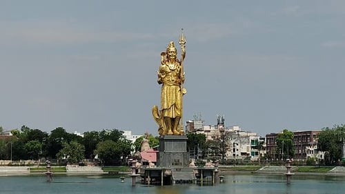Golden Lord Shiva statue in Sursagar Lake Vadodara Gujarat India - Spiritual icon close-up
