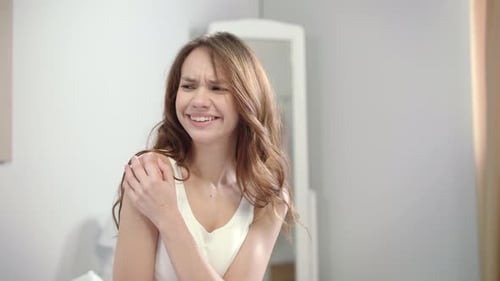 Woman Shoulder Pain. Young Woman Feeling Pain in Shoulder at Morning. Pretty