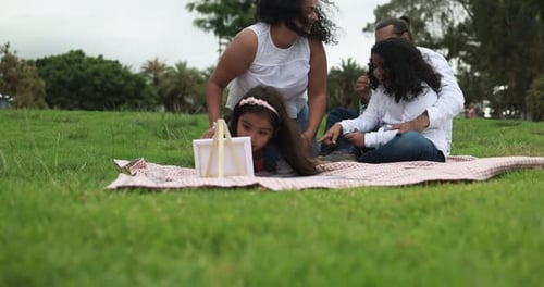 Indian Parents Having Fun at City Park Painting with Their Children -