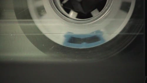 Close Up of Cassette Tape Spinning Retro Recording