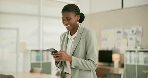 Happy black woman, phone and walking at office for social media, online networking or communication