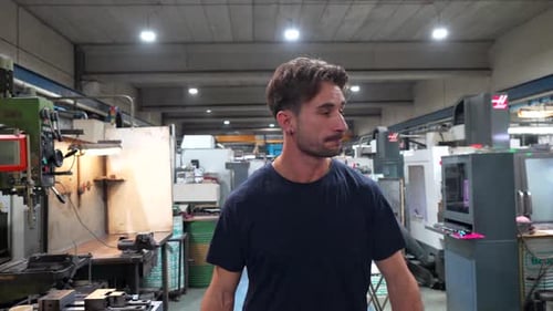 Portrait of a Young Manual Worker in a Cnc Factory