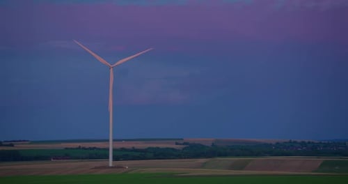 White Wind Turbines Rotate From the Wind Wind Energy is a Renewable Source of Green Energy Worldwide