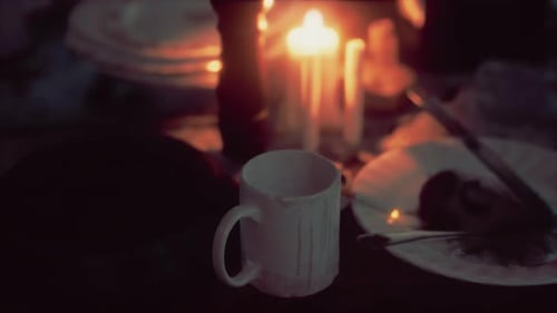 Warm Candlelight Dinner Setting with Romantic Ambiance