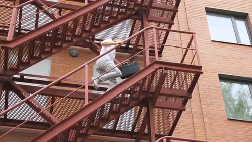 Hurry Young Businessman Running Up on Stair Going to Office Manager Hastily Climbing Up Staircase of