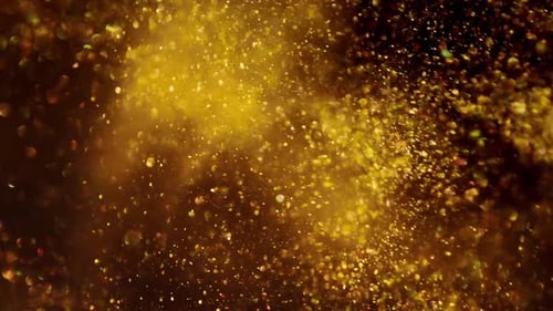 Swirling Golden Glitter Shimmers in Abstract Motion