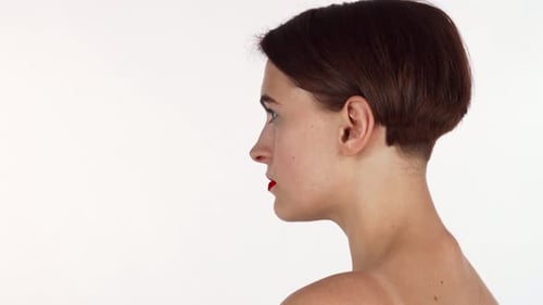 Elegant Woman with Short Hair Turns to Camera