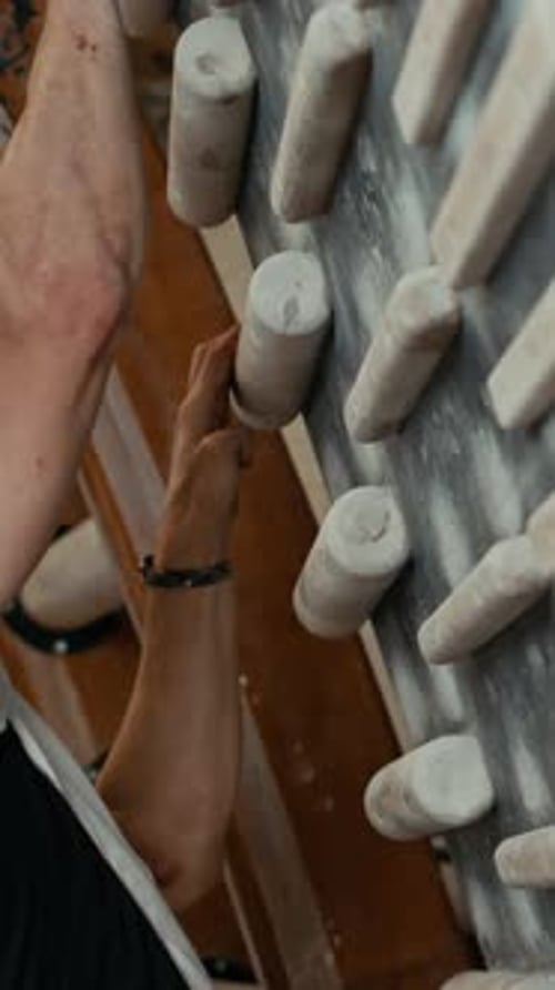 Vertical of Middle-Aged Determined Man Climbing Wall in Climbing Center