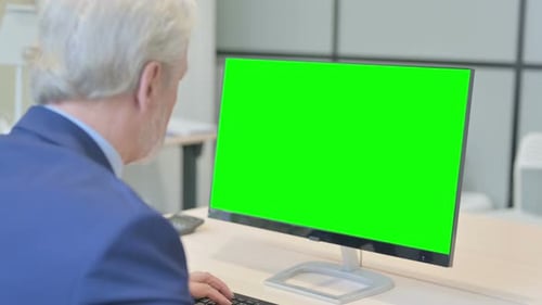 Senior Old Businessman Using Desktop with Green Screen