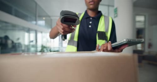 Delivery Worker Scanning Package in Modern Office