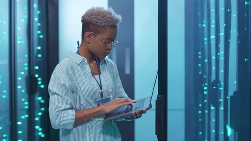 A Highly Skilled and Professional Female IT Specialist Actively Working in a Data Center