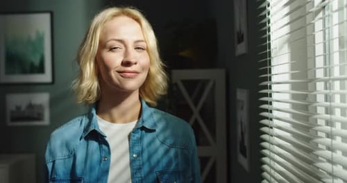 Smiling Woman at Home Standing by Window