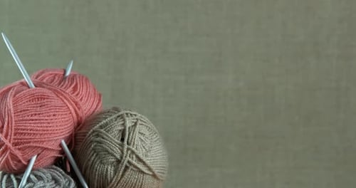 Yarn Balls with Knitting Needles Stacked