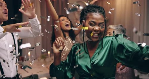 People, dancing and new year party with confetti in celebration, happy and excited in night