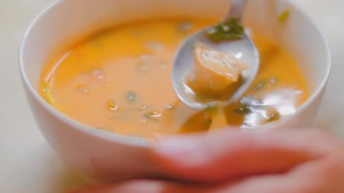 Creamy Soup Being Stirred in a Bowl