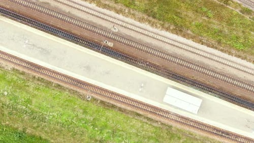 Railway cargo train wagon rides on railroad. Transportation and delivery of cargo in containers. Aer