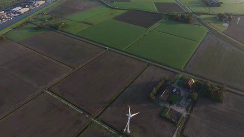 Aerial view of sunrise over village fields, Netherlands.