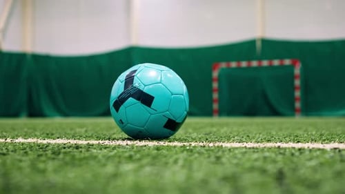 close-up of a soccer player's foot kicking the ball for a penalty or a goal or passing a ball