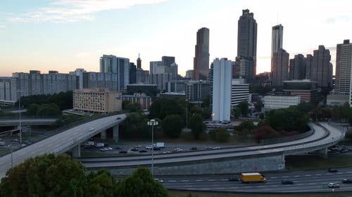 Downtown Atlanta traffic on interstate highway freeways. Aerial at golden hour.