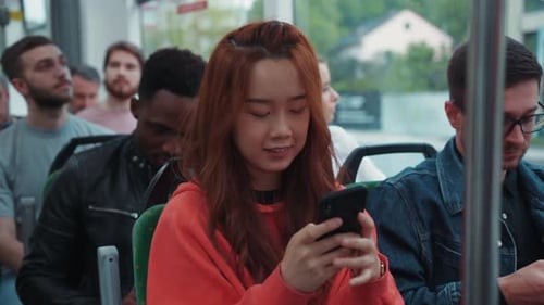 People Riding Public Transportation, Using Cell Phones