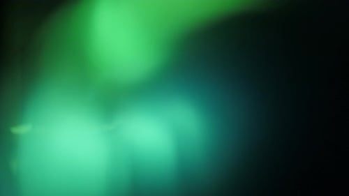 Illuminate Collection: Rotating light leak transition with a green hue