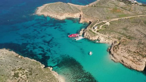 Scenic Comino Island And Blue Lagoon In Malta - aerial drone shot