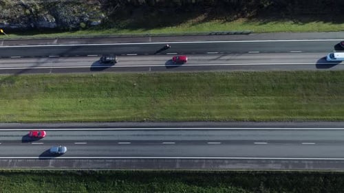 Bird's eye view of four lane divided highway traffic driving pattern