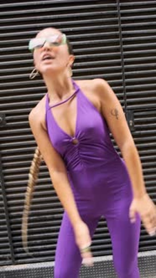 Merry Young Woman Starting to Dance on Street