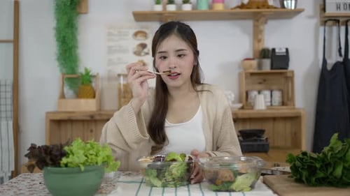 Woman Enjoying a Healthy Salad at Home