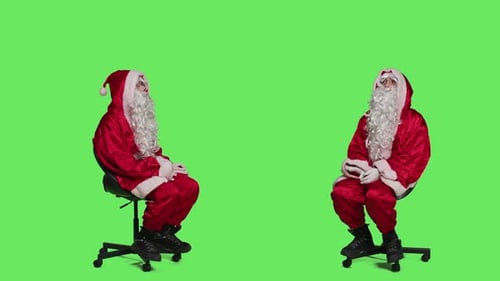 Santa Figures Sitting on Rolling Chairs on Green Screen