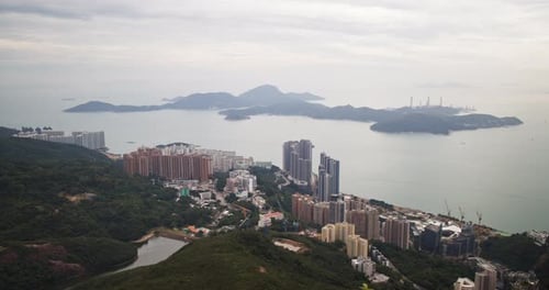A breathtaking view of Hong Kong showcases the coastline and urban developments from a high vantage
