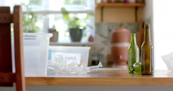 Segregation plastic boxes for waste, plastic and glass bottles on table ...