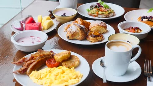 Breakfast in Restaurant Fresh Pastries Fruits Omelette Toast Yogurt