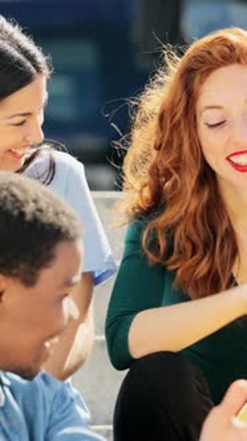 Friends Laughing Together on Sunny Day in the City