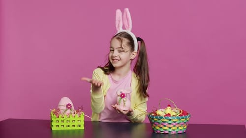Cute Girl Wearing Bunny Ears Sends Easter Kisses