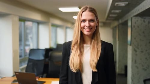 Smiling Caucasian Business Woman in Formal Outfit Looking at Camera Standing in Office Portrait of