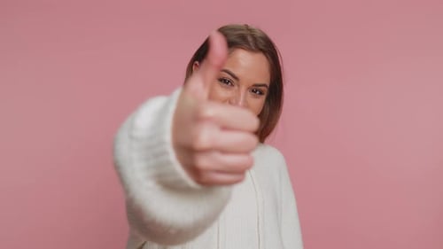 Woman Gives Two Thumbs Up Sign of Approval