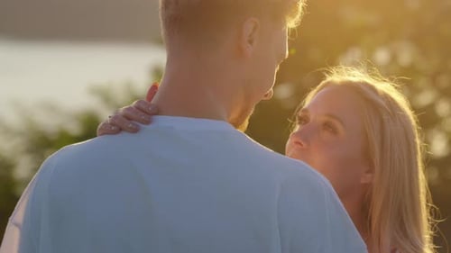 Couple in Love Kissing During Golden Hour