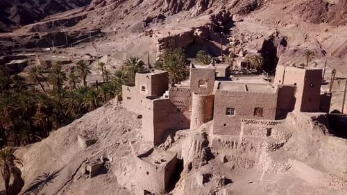 Fly around terrace old town palm dates garden in summer in desert area
Oasis in hot summer local peo