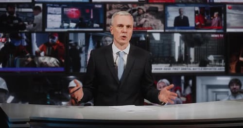 Serious Mature Male News Anchor Reporting on Global Conflict in Professional Television Studio