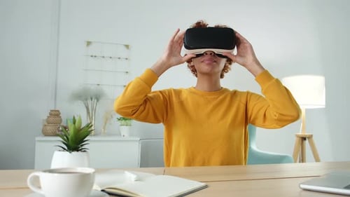 Young Woman Using Virtual Reality Headset at Home