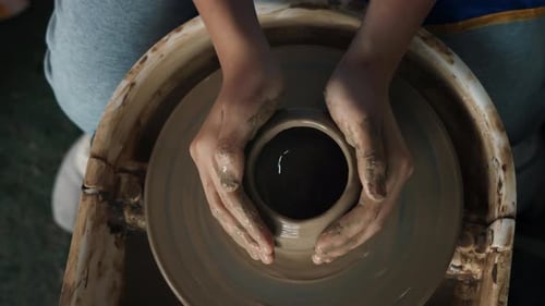 Artisan Craftsmanship Expert Hands Shaping a Beautiful Bowl on a Pottery Wheel Top View