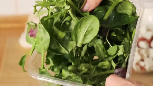 Fresh arugula leaves, top view. Bunch of green fresh arugulaю. The concept of a healthy lifestyle
