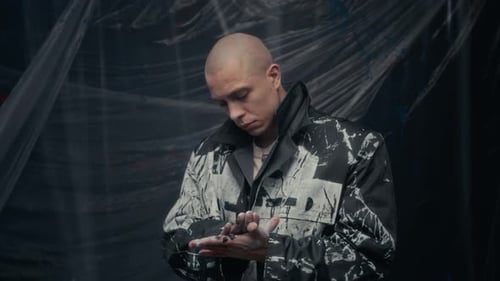 Portrait of Young Creative Male Fashion Designer Wearing Painted Coat