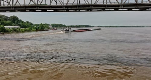 Memphis Tennessee Aerial v52 cinematic low flyover mississippi river under the bridges over the tugb