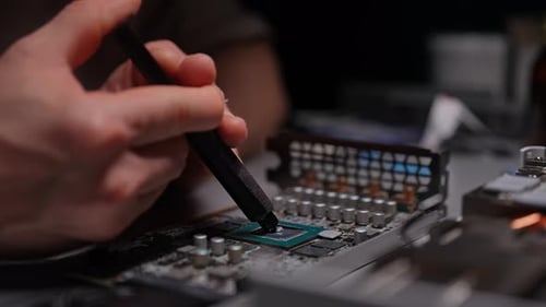 Hands Apply Thermal Paste to Computer Processor