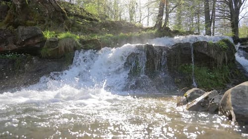 Small Waterfall on a Sunny Day A Small Mountain River Flowing Through the Forest Nature of the